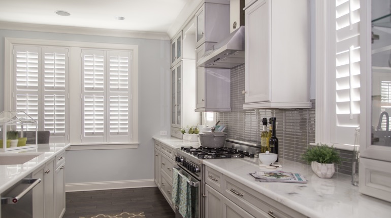Polywood shutters in Jacksonville kitchen with marble counter.